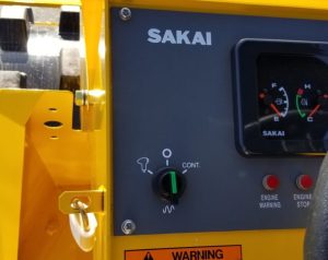 SV204D soil roller dash panel showing the vibratory mode selector switch with on demand button, offf, and continuous modes.