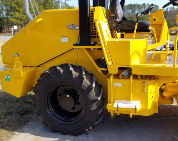 Sakai SV204D soil compactor lug or tractor style tires as standard equipment.