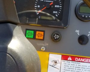 SV204D soil roller switch panel showing diesel after treatment lights and regen switch.