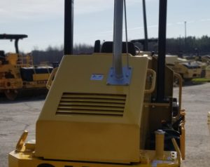 Rear of Sakai SV204D vibratory 5 ton soil compactor showing the raised exhaust for trench compaction work.