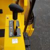 Close up of forward neutral reverse lever on the SV414 soil compactor operator deck.