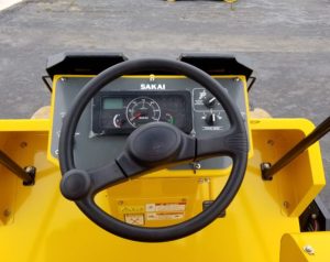 Sakai SV414D smooth drum soil compactor operator dash and controls.