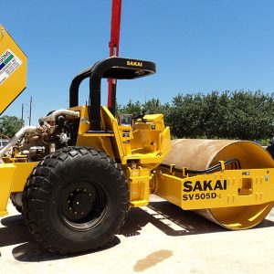 Sakai SV505D smooth drum vibratory dirt roller with hood open.