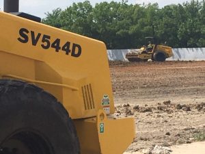 Sakai SV544 vibratory padfoot soil compactors on a jobsite.