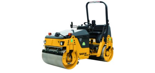 Sakai SW354 vibratory tandem asphalt compactor in yellow with metal hood.