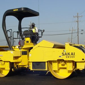 Sakai SW990 tandem asphalt roller with 180 degree swivel operator station.