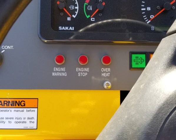 Warning lights on the SV204T padfoot soil compactor dash.