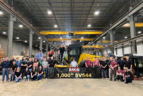 SAKAI America employees pose for a photo with the 1000th SV544 84" soil compactor inside the Adairsville, Georgia factory.