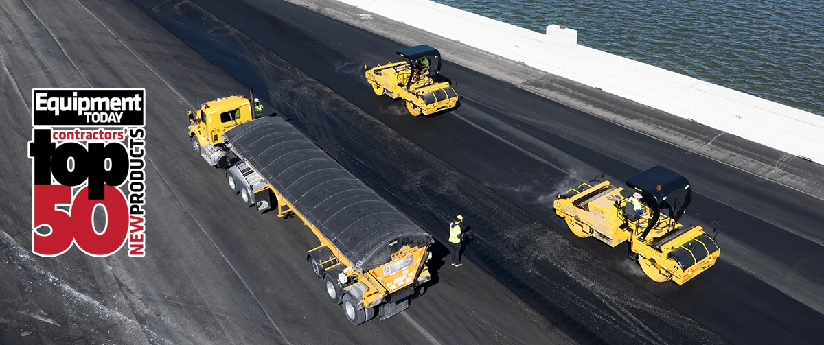 Aerial drone view of two SAKAI 79 inch SW884 highway class asphalt rollers compacting fresh asphalt on the Howard Frankland Bridge in Tampa, Florida.