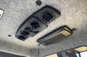 Climate control unit in the top of the SV544 or SV414 soil compactor enclosed cab.