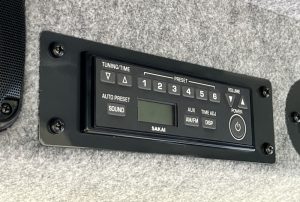 Radio head unit inside the SAKAI SV544 or SV414 soil compactor enclosed cab.