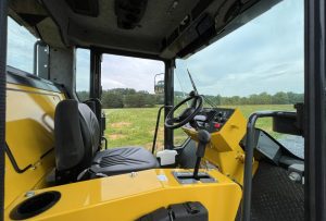 Interior right side view of the enclosed cab for SV544 and SV414 soil compactors.