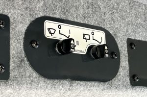 Close up of the front and rear wiper switch inside the SAKAI SV544 or SV414 soil compactor enclosed cab.