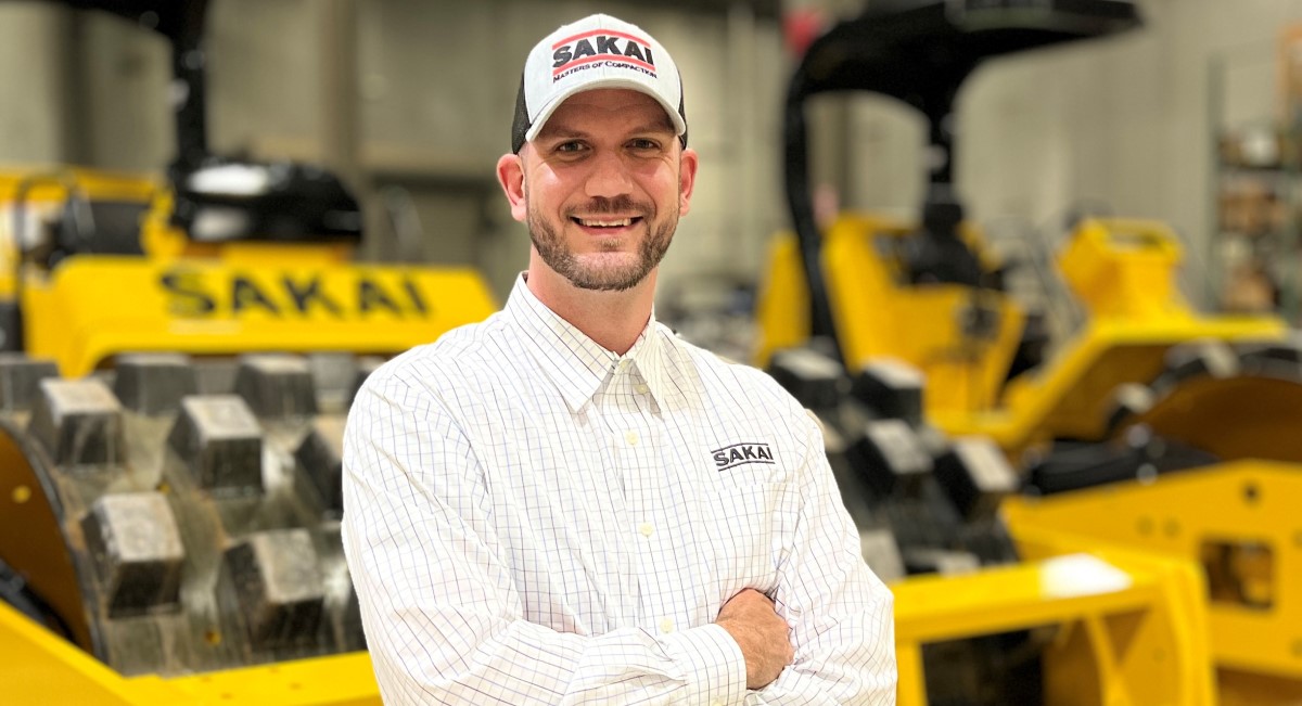 TJ Hopkins, the new regional sales manager for SAKAI compaction equipment dealers in the northeast US and eastern Canada, standing in front of soil compactors in our Georgia factory.