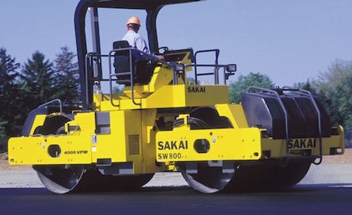 Historical photo of a Sakai SW800 vibratory double drum highway class asphalt roller for paving.