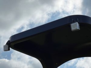 Front view of the optional LED work lights for the SAKAI GW754 vibratory pneumatic tire roller to illuminate the job site for night asphalt paving.