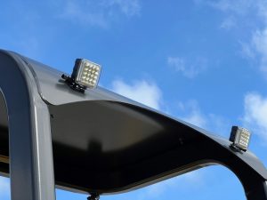 Rear view of the optional LED work lights for the SAKAI GW754 vibratory pneumatic tire roller to illuminate the job site for night asphalt paving.