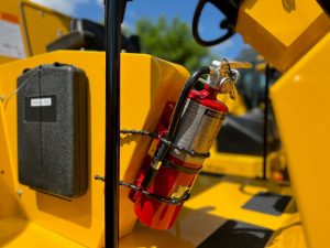 Optional fire extinguisher mounted to the SAKAI SV414 soil compactor.