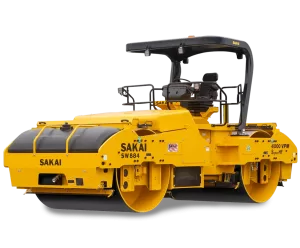 A yellow Sakai SW884 highway class 79 inch 14 ton vibratory tandem double drum asphalt roller.