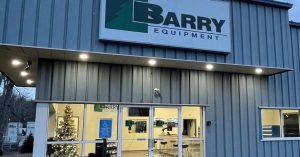 New Sakai dealer Barry Equipment Webster Massachusetts location shown at night.