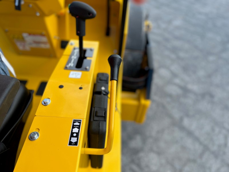 Sakai SV414 soil compactor leveling blade up down control lever.
