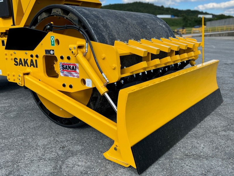 Sakai SV414 padfoot soil compactor with smooth shell kit and dozer blade kit options.