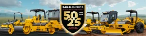 Row of yellow Sakai construction machines on a site, centered with a shield logo reading '50 25' for the 50th anniversary of Sakai America.",