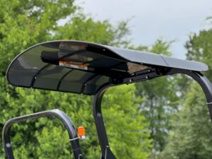 Side view of the optional adjustable sun shade or canopy available on the SAKAI compact asphalt roller line.