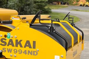 Side view of the optional front safety mirror kit for the highway class Sakai asphalt roller line.