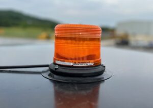 Another view of the accessory magnetic LED beacon or strobe light available on SAKAI's large asphalt roller line.