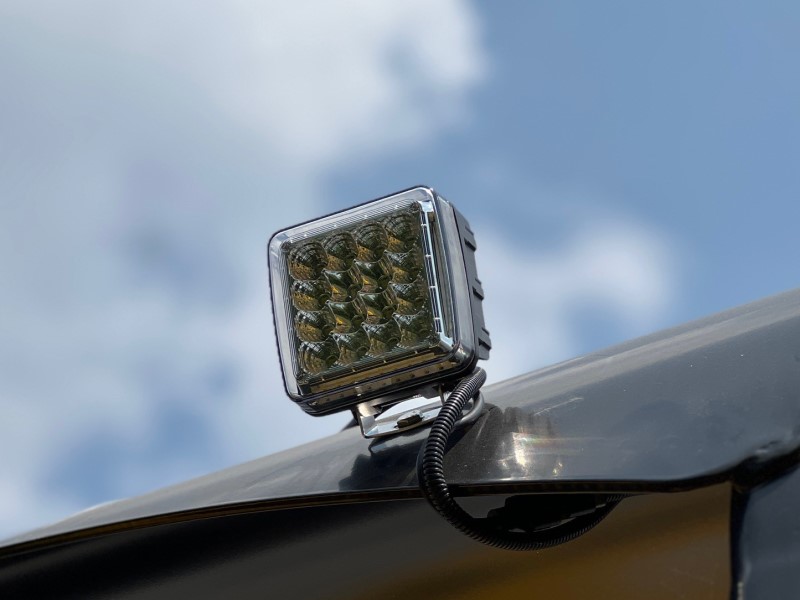 Close up of the LED work light assembly on a Sakai 66" asphalt roller.