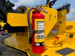 Another view of the mounted fire extinguisher accessory on SAKAI asphalt rollers.