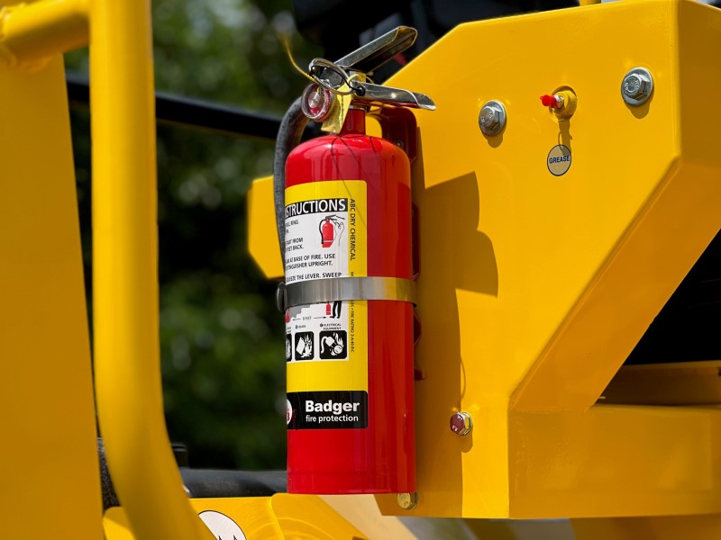 Badger or equivalent ABC fire extinguisher and mount kit as shown on a SAKAI asphalt roller operator station.