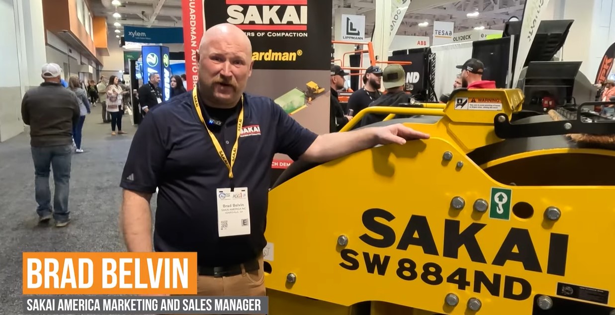 Still photo of an interview of Brad Belvin at SAKAI America by Equipment World magazine at World of Asphalt 2024.