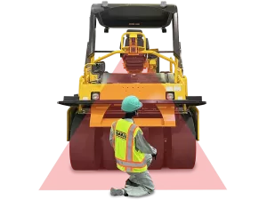 Rear view of a SAKAI GW754G vibratory pneumatic tire roller or PTR equipped with the automatic emergency braking system called Guardman with a paving worker behind the machine within a detection beam.