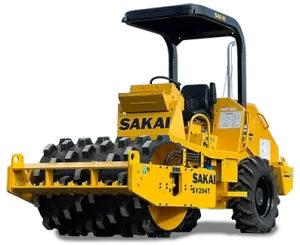 A SAKAI SV204T 5 ton vibratory padfoot soil compactor or dirt roller for residential site work or trench and utility work.