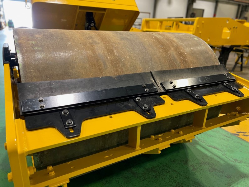 Front view of new vulcanized rubber scraper blade assembly for 8 ton Sakai soil compactors.