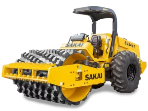 A yellow Sakai SV544T 84 inch 12 ton soil compactor with padfoot or sheeps foot drum and lug tires.